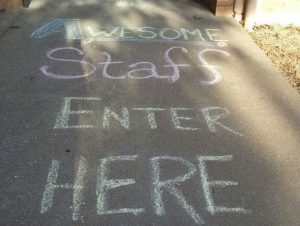 "Awesome Staff Enter Here" written in chalk on the sidewalk outside of Freshen Your Nest main office. "Awesome Staff Enter Here" written in chalk on the sidewalk outside of Freshen Your Nest main office.