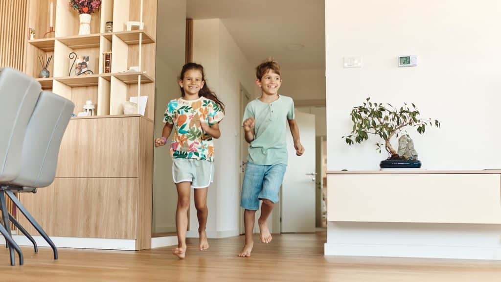 Children enjoying a clean home after professional residential cleaning service.
